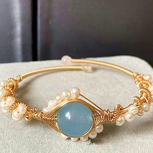 Bracelet verguld met blauwe steen